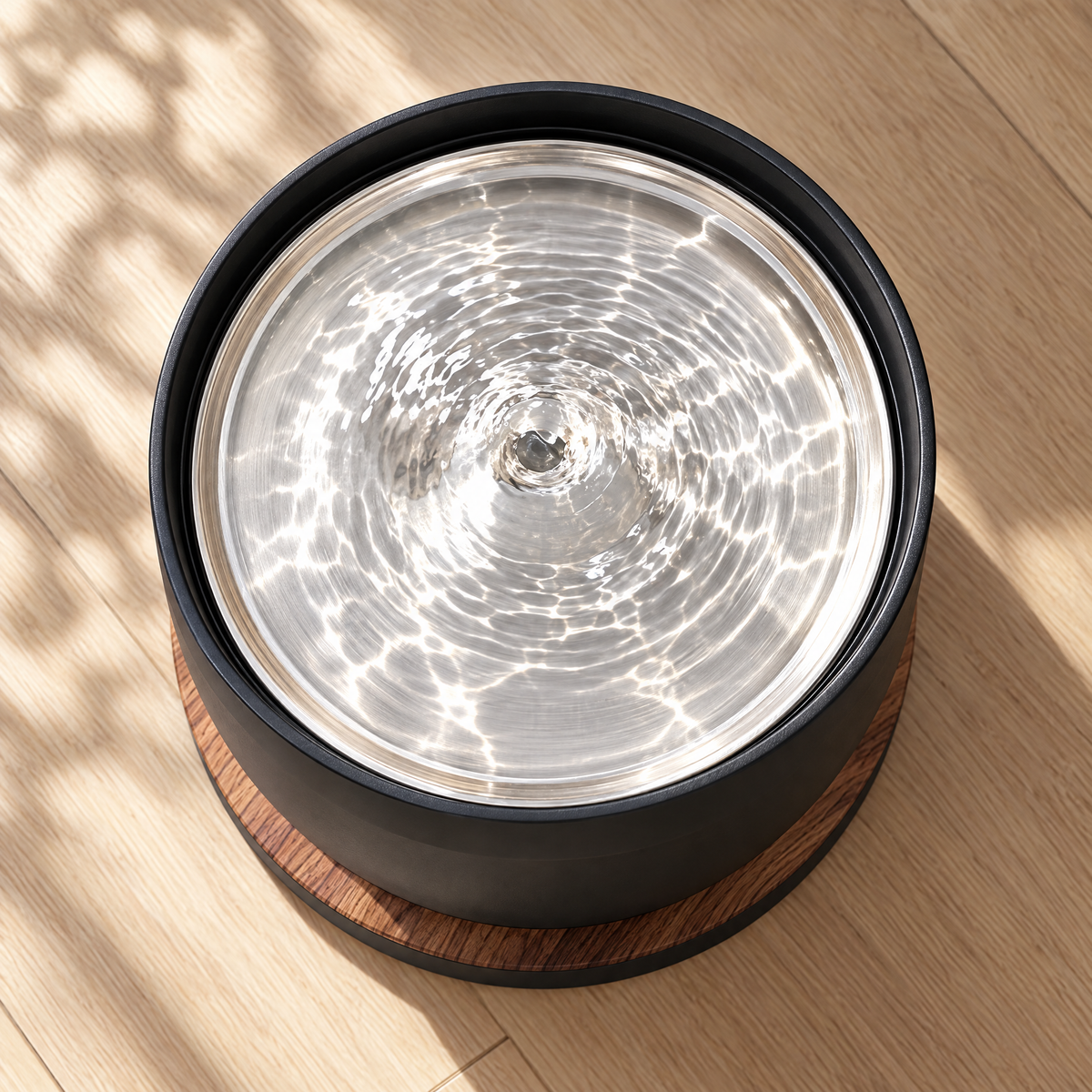 Top view of the brushed steel tray with moving water